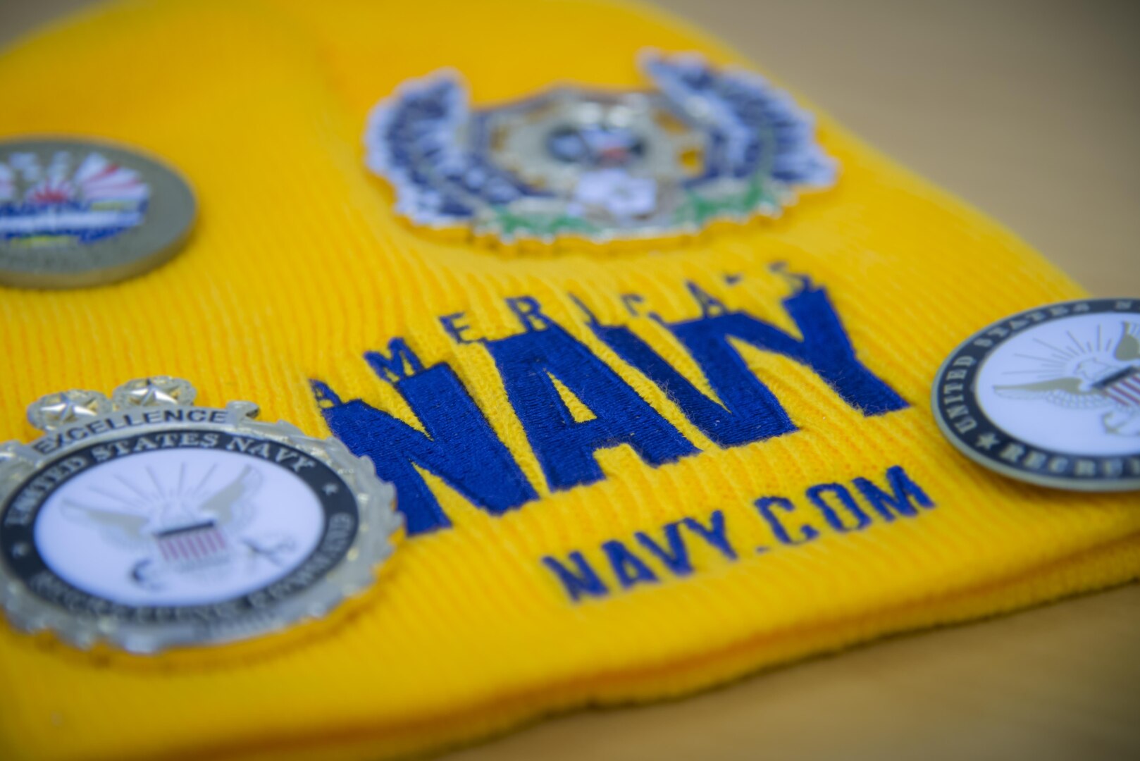 An America’s Navy hat laying on Petty Officer First Class Christopher Thomas, Navy Recruiting District San Antonio recruiter, desk Oct. 25, 2017.  Thomas’ mission is to find officer applicants to lead naval forces in conducting operations on land, air and sea.  (U.S. Air Force photo by Sean M. Worrell)