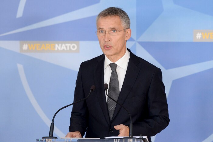 NATO Secretary General Jens Stoltenberg speaks at a podium.