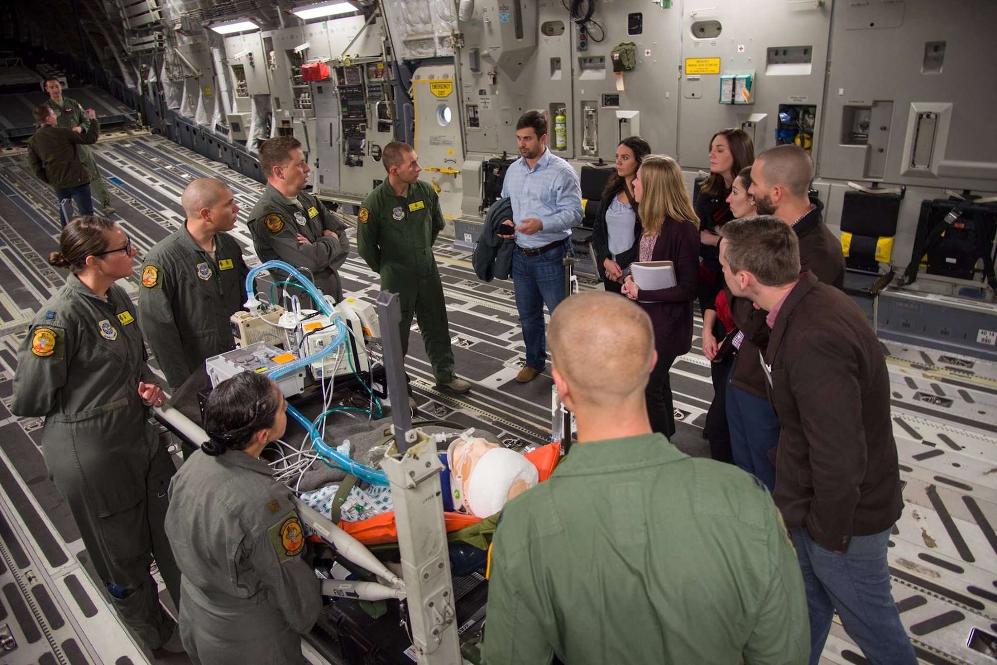 Congressional staff delegates receive a briefing from members of the 349th Aeromedical Evacuvation Squadron on Nov. 20, 2017, at Travis Air Force Base, Calif. The congressional delegates visited Travis AFB to learn more about the installation's mission. (U.S. Air Force photo by Staff Sgt. Daniel Phelps)