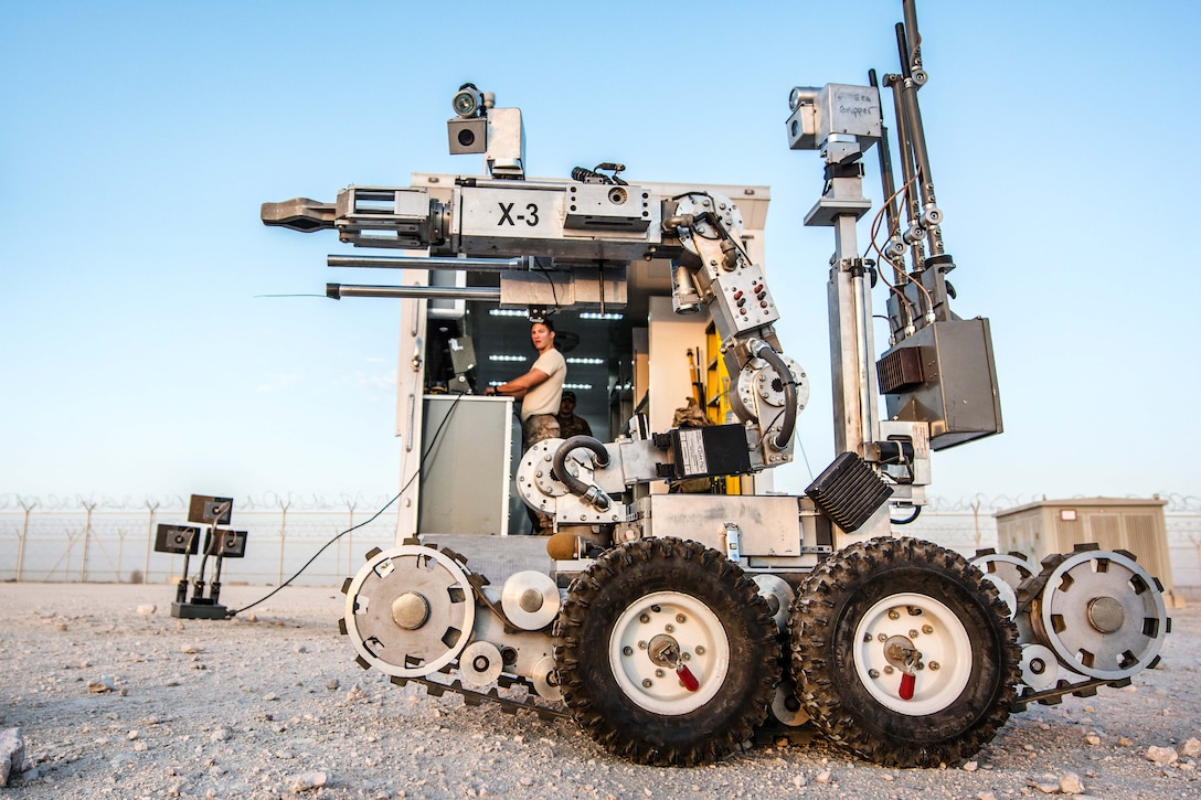 Airman Taylor Lahteine operates a Remotec Andros F6A Remote Ordnance Neutralization System during a joint chemical threat training exercise.