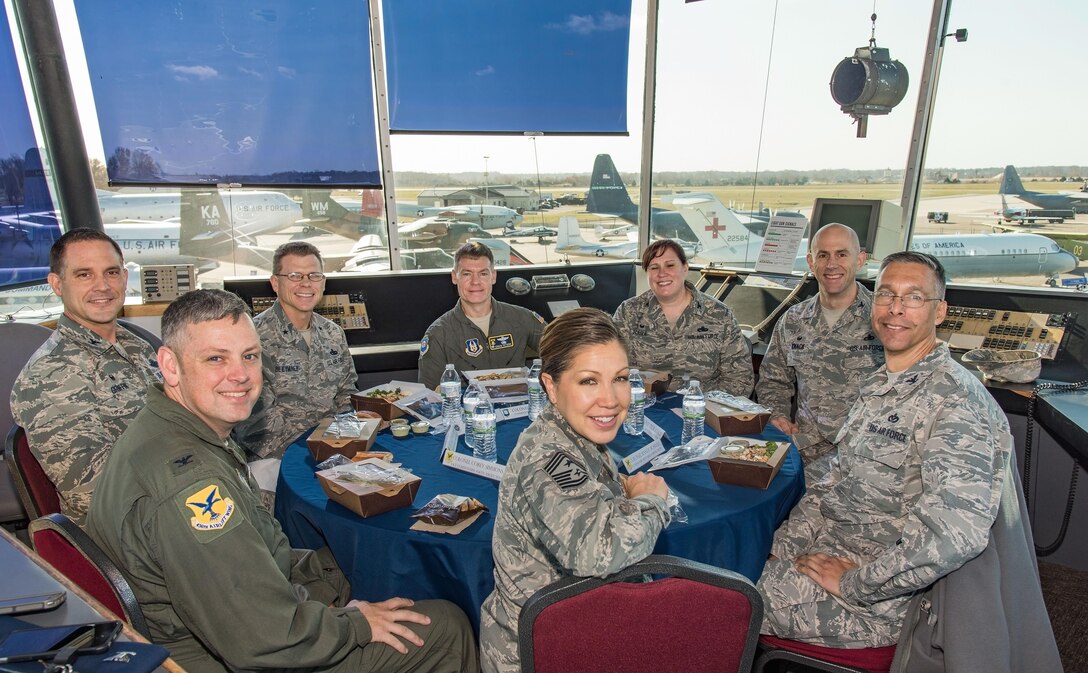 Brig. Gen. Steven Bleymaier, Director of Logistics, Engineering and Force Protection, Headquarters Air Mobility Command, Scott Air Force Base, Ill., and senior leadership from the 436th and 512th Airlift Wings, pose for a photo before lunch Nov. 30, 2017, on Dover Air Force Base, Del. Bleymaier and the senior leaders had lunch in the cab of the old Dover AFB control tower that is on display at the Air Mobility Command Museum. (U.S. Air Force photo by Roland Balik)