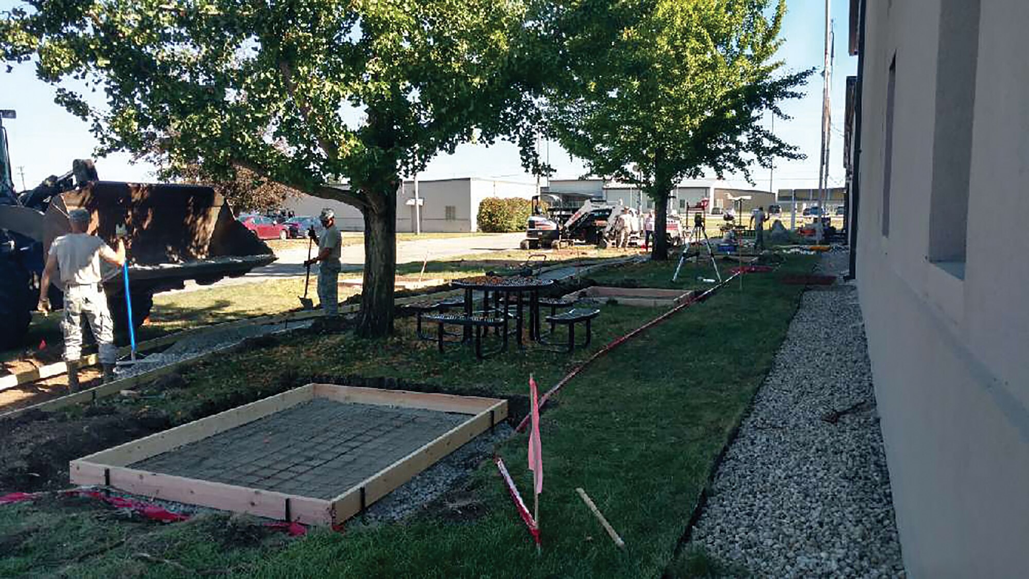 Members of the 445th Civil Engineer Squadron begin construction of Heritage Park outside the 445th Airlift Wing headquarters building. The park, scheduled to be completed by Sept. 30, 2018, will consist of aircraft displays, unit emblems and park benches. (Courtesy photo)