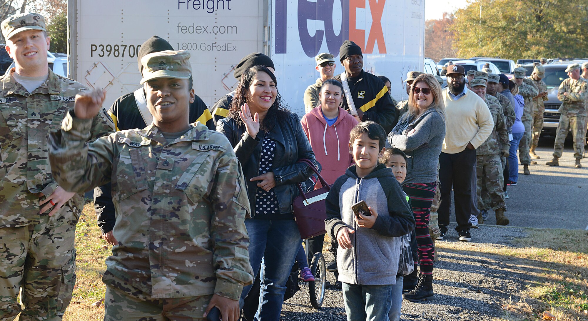 Active-duty families wait in line to pick out free Christmas trees during the Christmas SPIRIT Foundation’s Trees for Troops program at Joint Base Langley-Eustis, Va., Dec. 1, 2017.