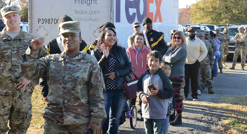 Active-duty families wait in line to pick out free Christmas trees during the Christmas SPIRIT Foundation’s Trees for Troops program at Joint Base Langley-Eustis, Va., Dec. 1, 2017.