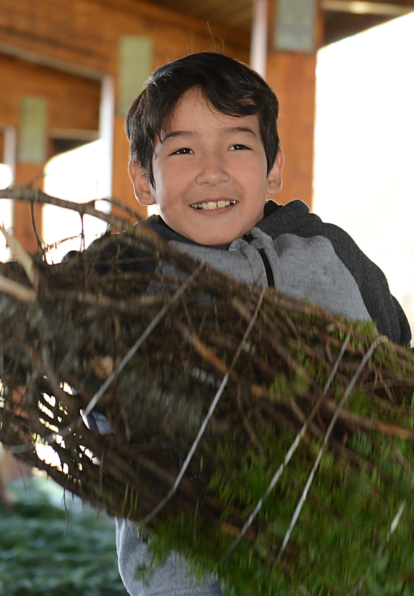 Maverick Jimenez, age nine, son of U.S. Army Chief Warrant Officer 2 Angel Jimenez, 7th Transportation Brigade (Expeditionary), picks a tree for his family during the Christmas SPIRIT Foundation’s Trees for Troops program at Joint Base Langley-Eustis, Va., Dec. 1, 2017.