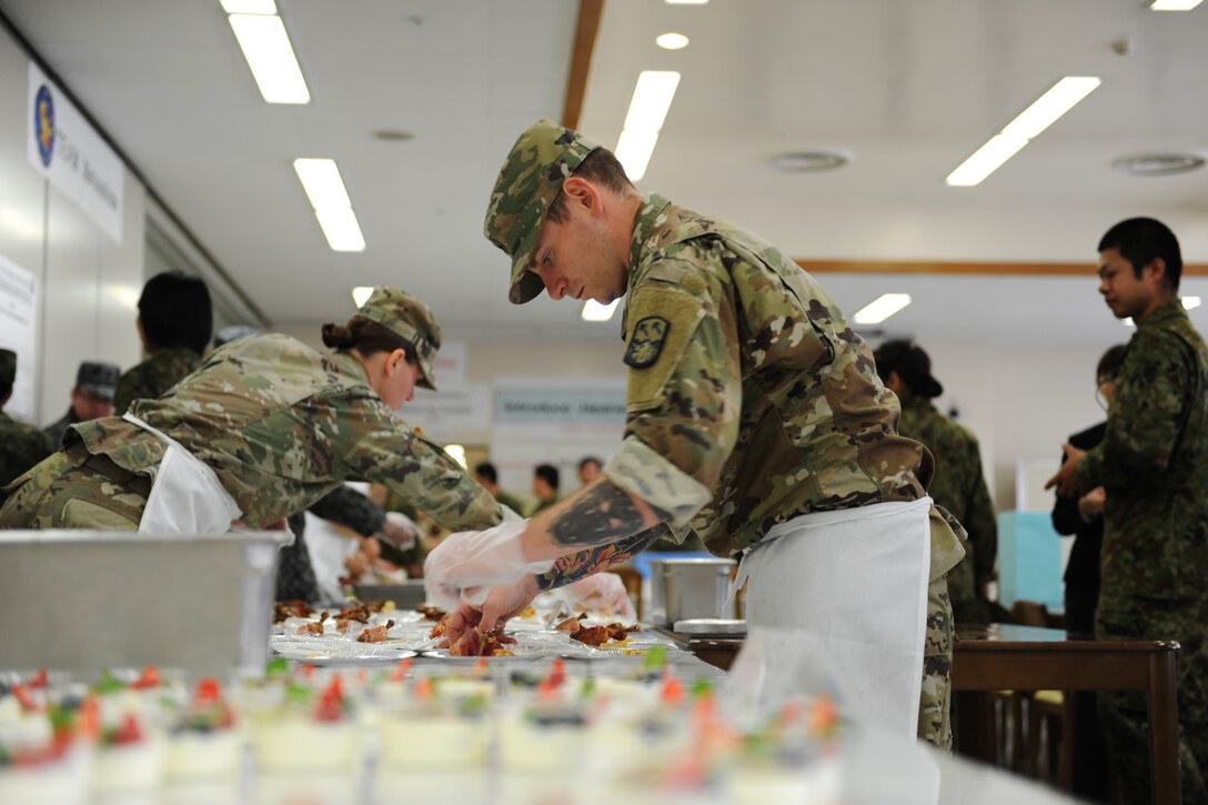 Soldier prepares chicken and waffles