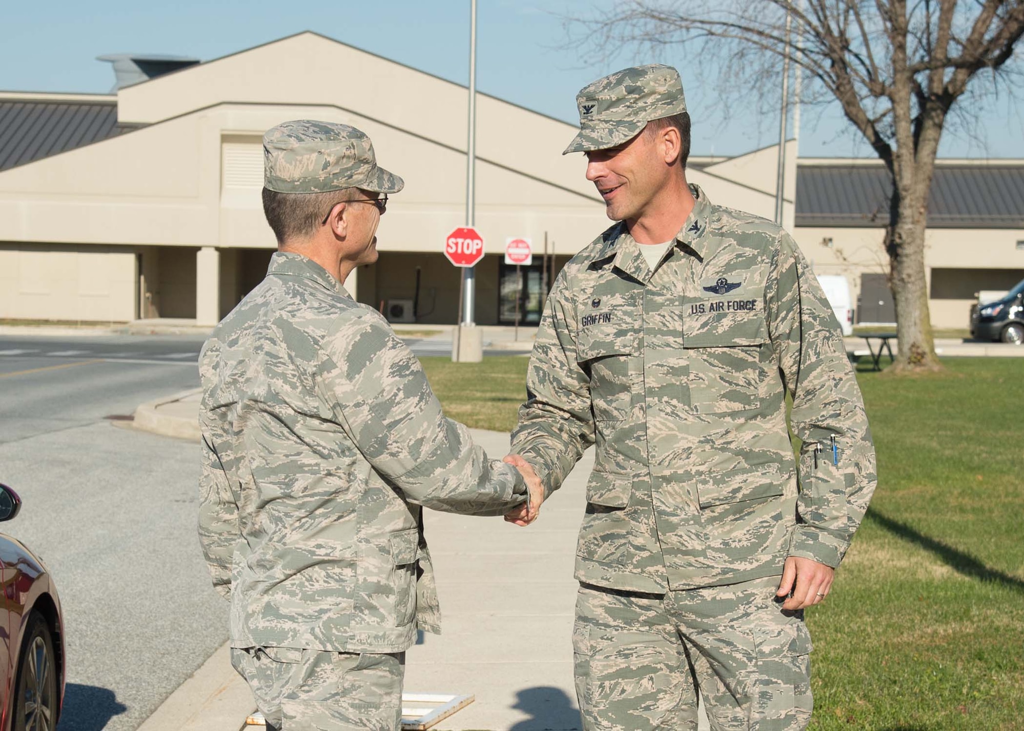 Brig. Gen. Steven Bleymaier, Director of Logistics, Engineering and Force Protection, Headquarters Air Mobility Command, is greeted by Col. Ethan Griffin, commander of the 436th Airlift Wing, upon arrival Nov. 29, 2017, at Dover Air Force Base, Del.