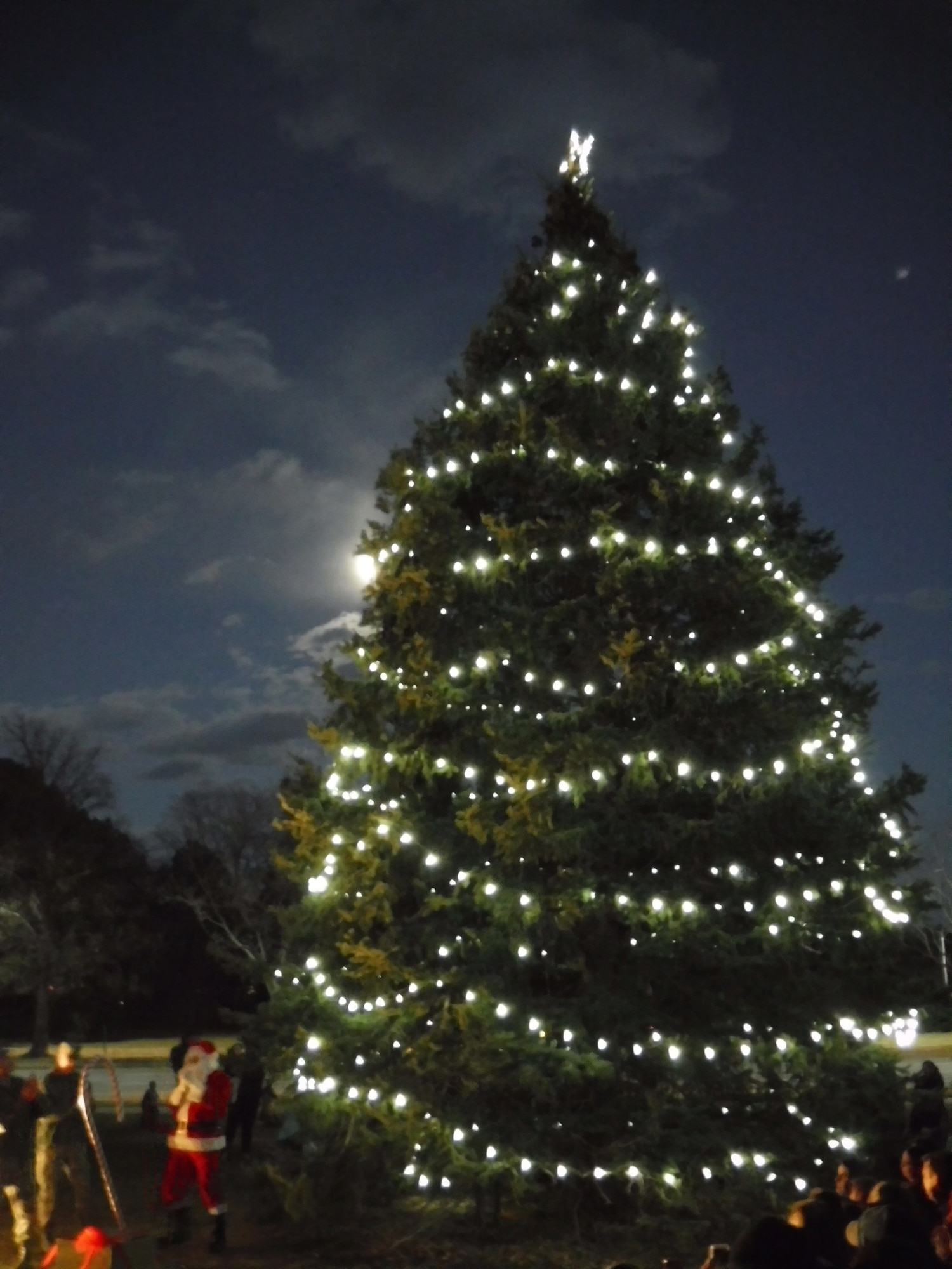 PETERSON AIR FORCE BASE, Colo. — Santa oversees the base holiday tree lighting at the Chapel on Peterson Air Force Base, Colorado, Dec. 1, 2017. The Chapel hosted Airmen and their families for cookies and cocoa after the event. (courtesy photo)