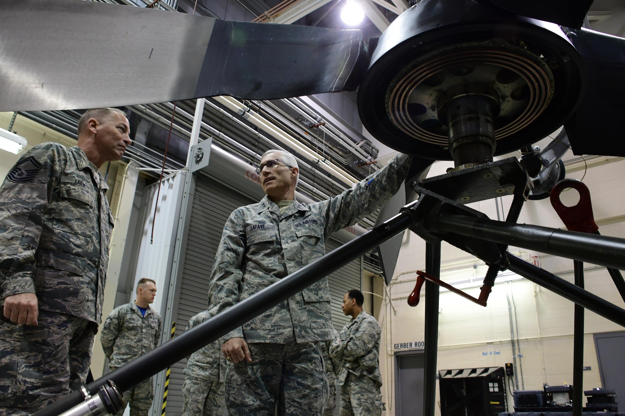 Maj. Gen. Craig La Fave, 22nd Air Force commander, examines a prop during a tour at Dobbins Air Reserve Base, Georgia Dec. 2, 2017. La Fave visited various facilities and met squadron leaders during the tour. (U.S. Air Force photo by Staff Sgt. Miles Wilson)