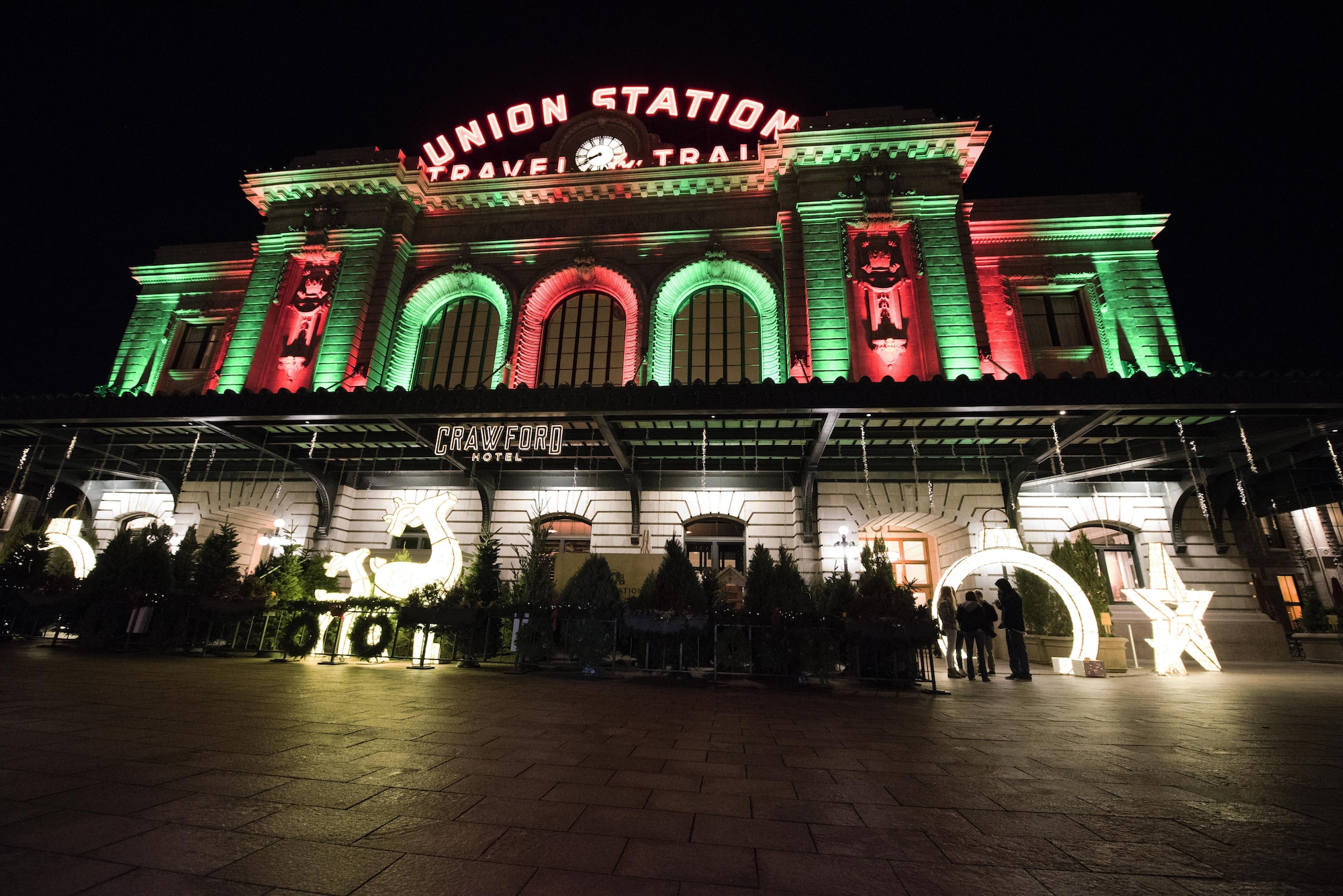 DENVER, Colo. – Christmas trees for sale in front of Union Station in Lower Downtown Denver, Colorado Dec. 1 2017. The building was lit in holiday colors creating a festive mood for nearby holiday shoppers. (U.S. Air Force photo by 2nd Lt. Justin Davidson-Beebe)