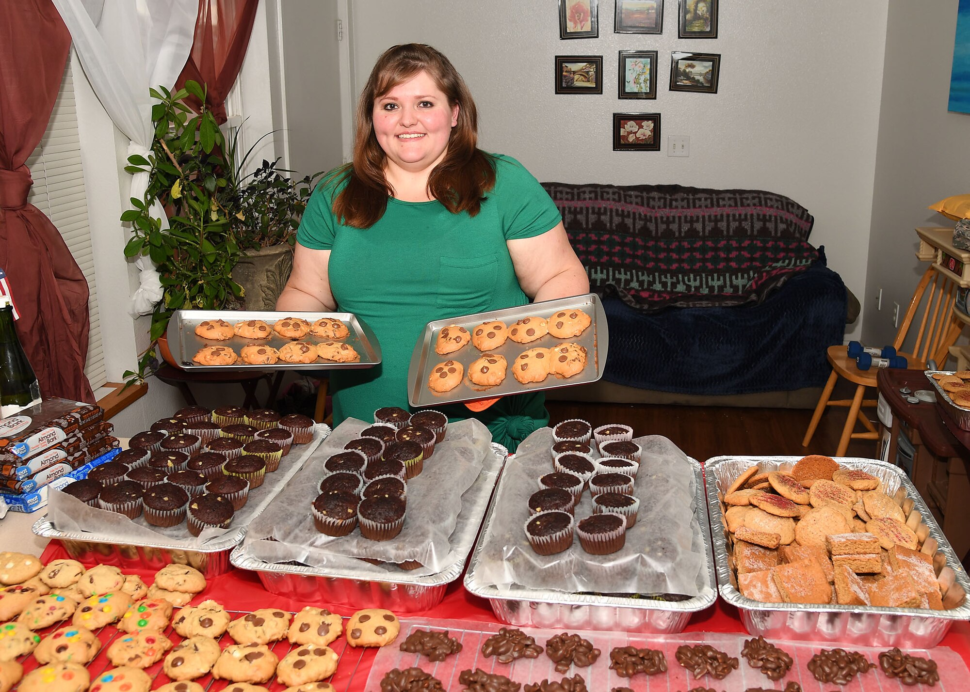 Nicole Lindgren, a member of the Spouses Club on base, baked nearly 500 cookies for the annual cookie drive on Grand Forks Air Force Base, N.D., Dec. 1, 2017. In addition to baking almost 500 cookies, Lindgren reached out to the community and received over 150-dozen more donations of muffins, popcorn balls and other assorted cookies. (U.S. Air Force photo by Airman 1st Class Elora J. Martinez)