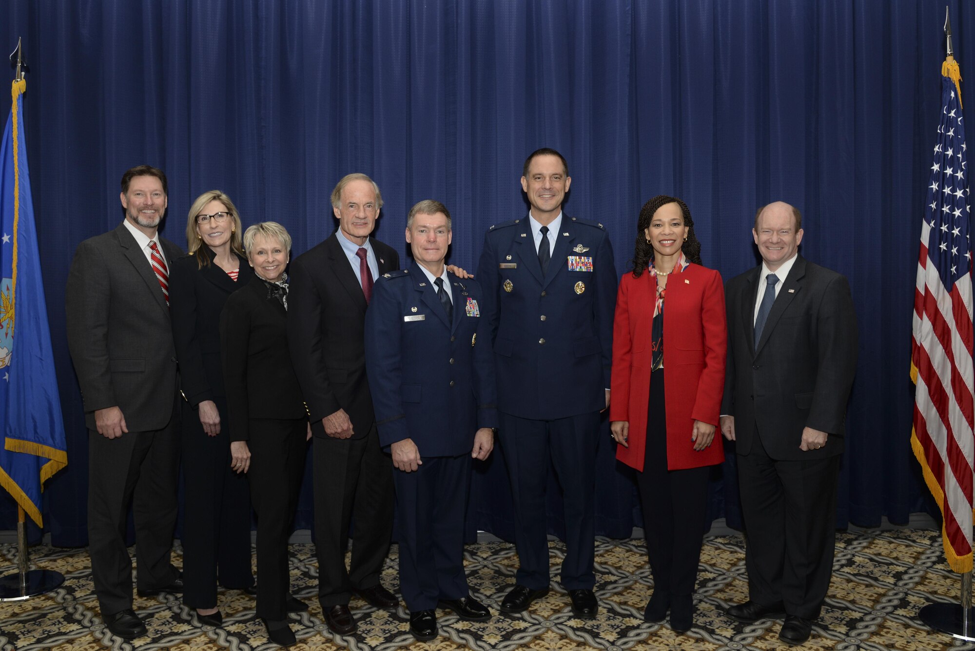 Col. Craig Peters, 512th Airlift Wing commander, and Col. Ethan Griffin, 436th AW commander, stand with Delaware politicians at the State of the Base Breakfast Nov. 20, 2017, at Dover Air Force Base, Del. Event speakers explained how both the base and Delmarva community benefit from the partnerships forged through teamwork. (U.S. Air Force photo by Staff Sgt. Aaron J. Jenne)