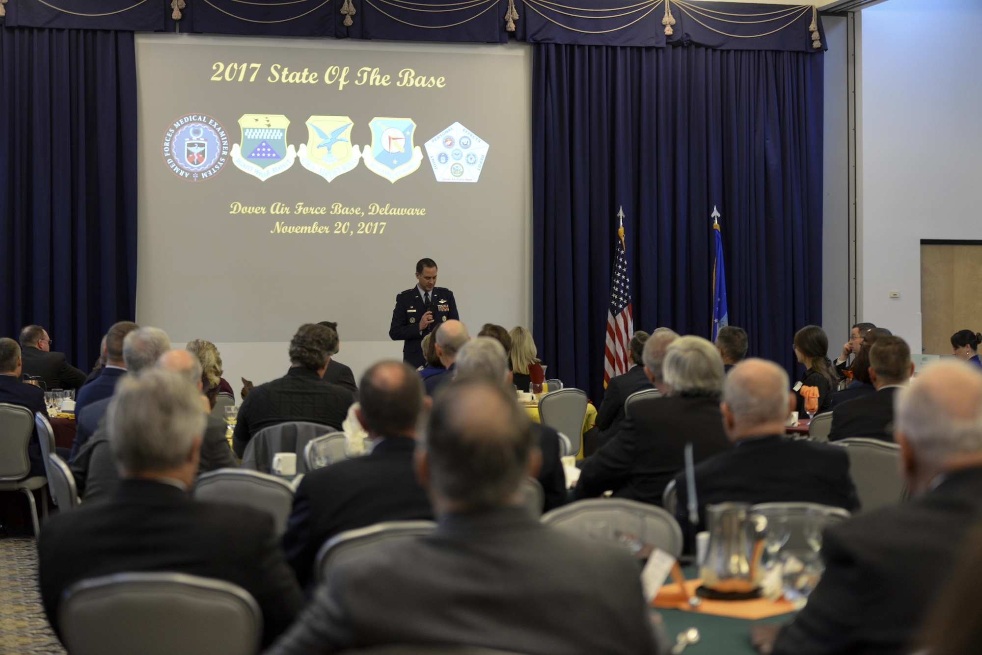 Col. Ethan Griffin, 436th Airlift Wing commander, speaks during the annual State of the Base Breakfast Nov. 20, 2017, at Dover Air Force Base, Del. Griffin shared the successes of the base throughout the year – the runway reconstruction project, approved construction efforts and hurricane relief missions – and highlighted influential Airmen from both the 436th and 512th Airlift Wings. (U.S. Air Force photo by Staff Sgt. Aaron J. Jenne)