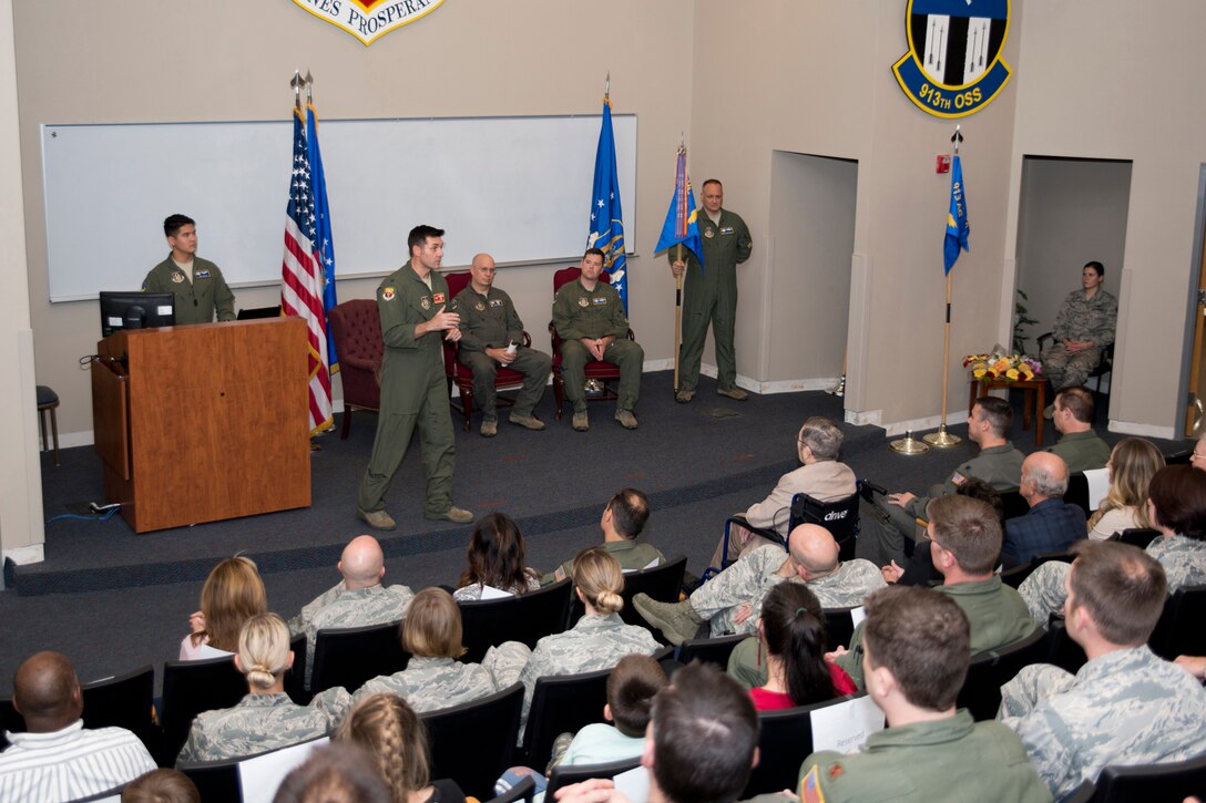 U.S. Air Force Reserve Col. Christopher T. Lay, commander, 913th Airlift Group, speaks to a crowd of family, friends and co-workers during the change of command ceremony for the 327th Airlift Squadron at Little Rock Air Force Base, Ark., Dec. 2, 2017.