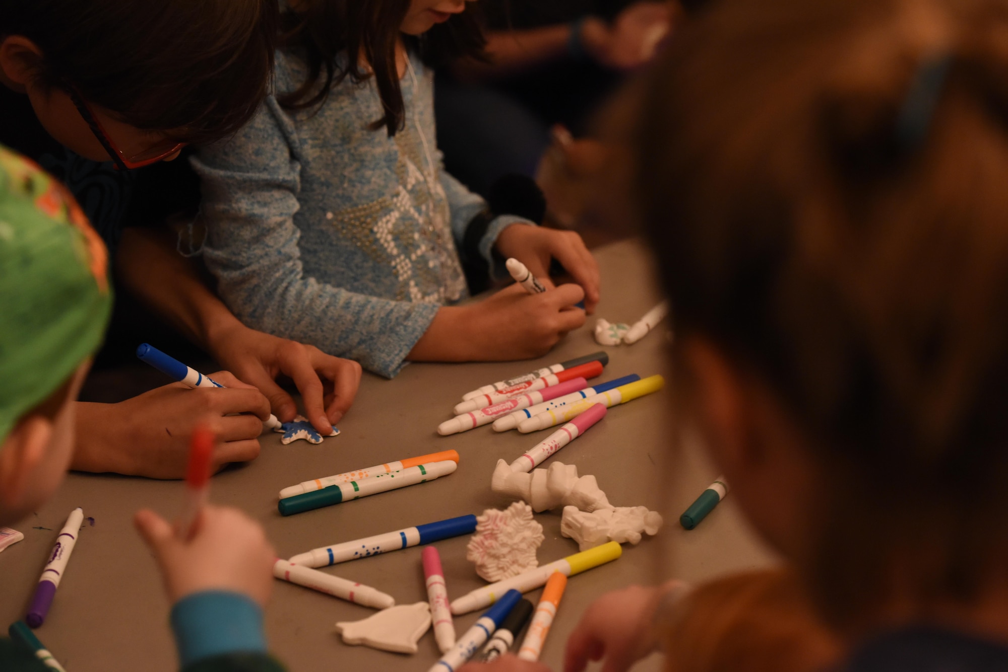 Children create decorations during the Tree Lighting ceremony at the Parade Field on Goodfellow Air Force Base, Texas, Dec. 4, 2017. Kids were able to create their own decorations and cookies as well as sit on Santa Claus’ lap to tell him what they want for Christmas. (U.S. Air Force photo by Airman 1st Class Zachary Chapman/Released)