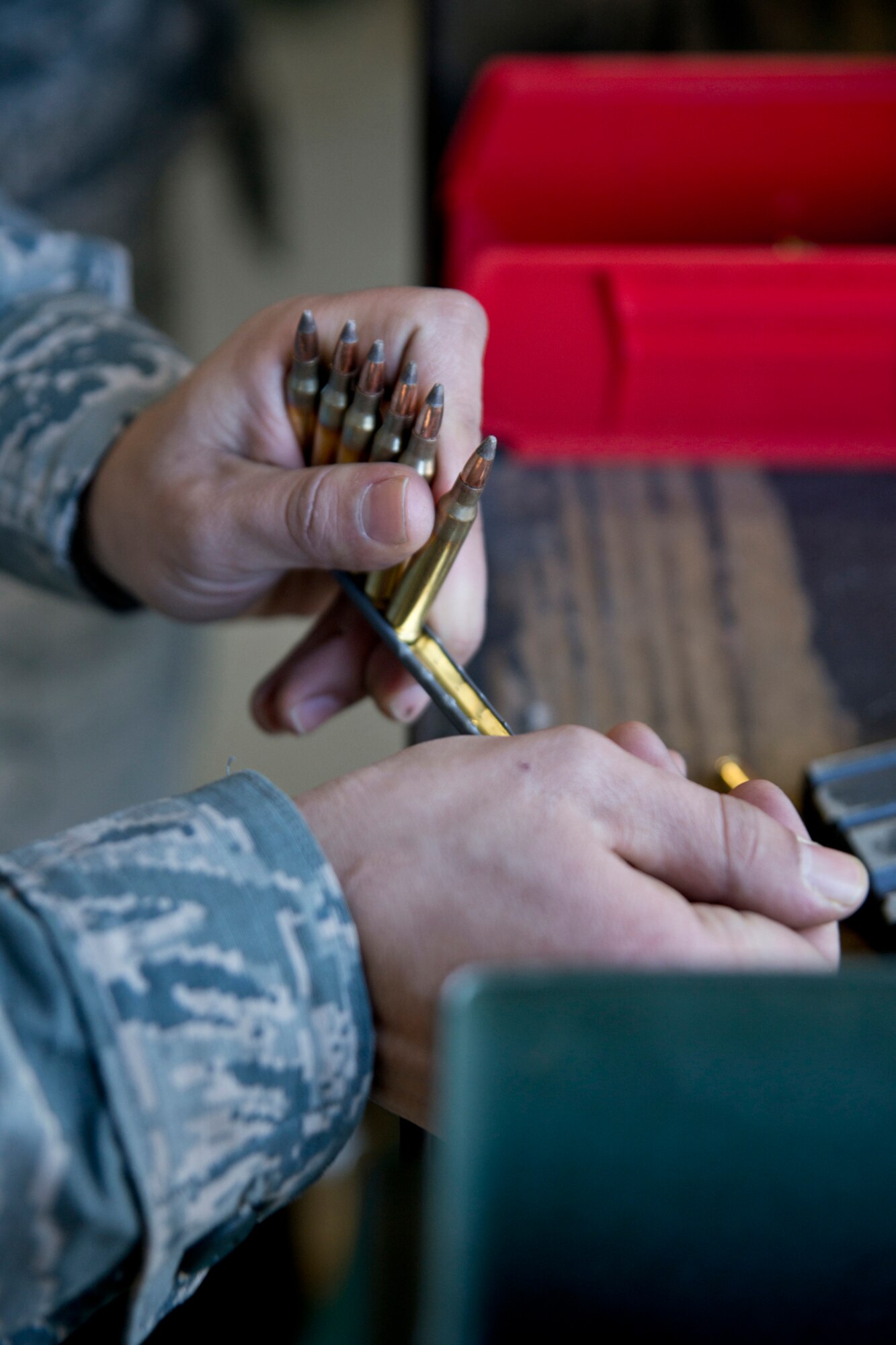 A U.S. Air Force Reserve Airman assigned to the 96th Aerial Port Squadron removes 5.56 x 45mm NATO cartridges from a stripper clip at the shooting range on Little Rock Air Force Base, Ark., Dec. 2, 2017.