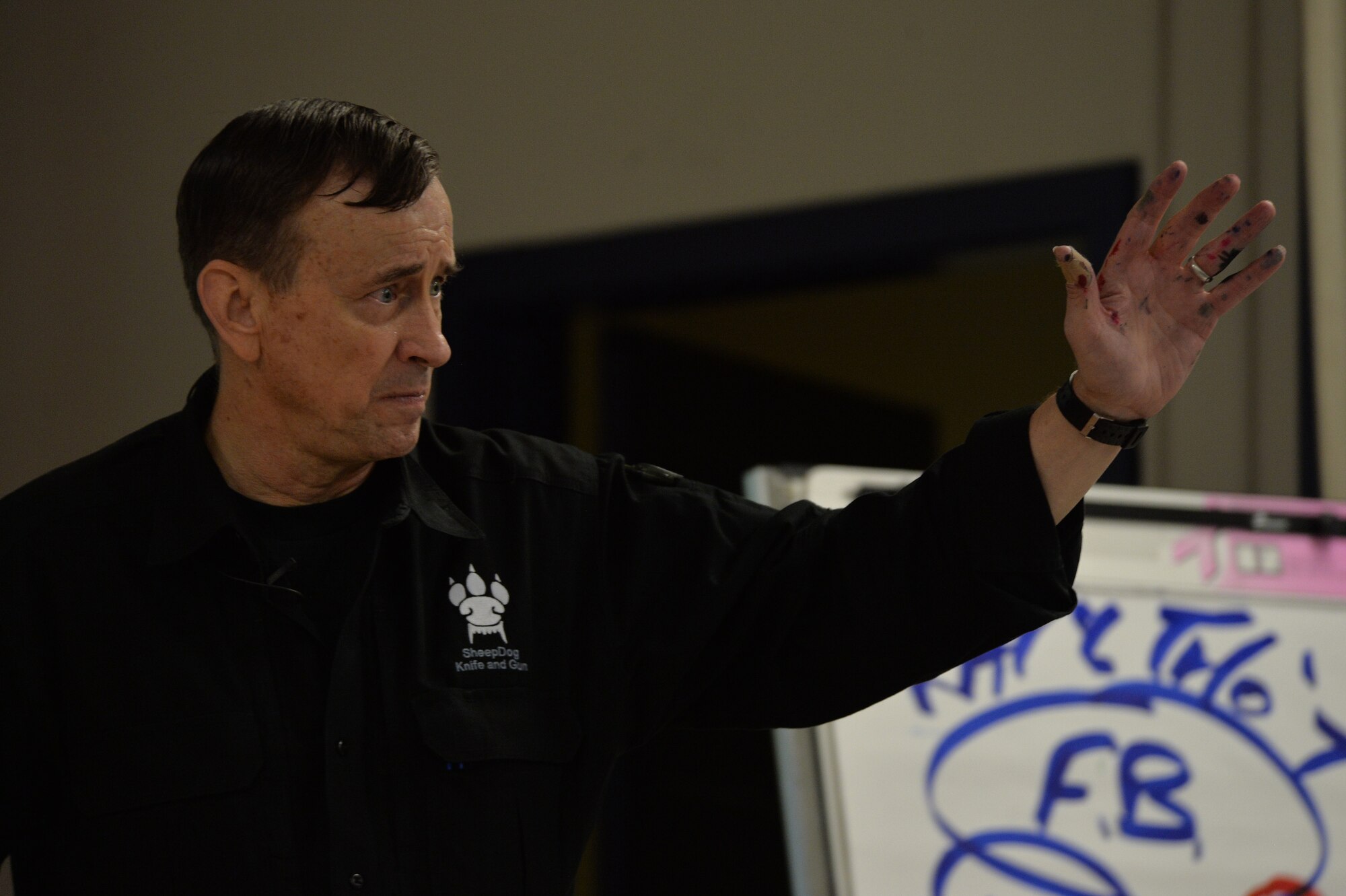 Retired Lt. Col. Dave Grossman explains to the audience some of the obstacles he and his wife have overcome after military service Nov. 13, 2017, at Creech Air Force Base, Nev. Grossman, a public speaker, visited team Creech to discuss mental fitness, the war on terrorism and each Airman’s importance to the Air Force mission. (U.S. Air Force Photo by Airman 1st Class Haley Stevens)