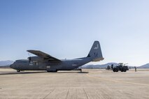 Airmen unload cargo from a C-130J Super Hercules from Yokota Air Base in preparation for exercise Vigilant Ace 18, Dec. 1, 2017, at Gwangju Airbase, Republic of Korea.