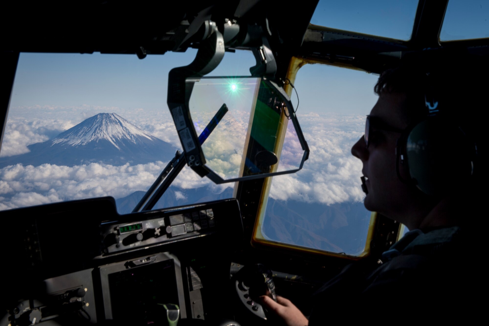 Capt. Kyle Schneider, 40th Airlift Squadron C-130J Super Hercules pilot, flies near Mt. Fuji, Dec, 1, 2017, over the Yamanashi prefecture.