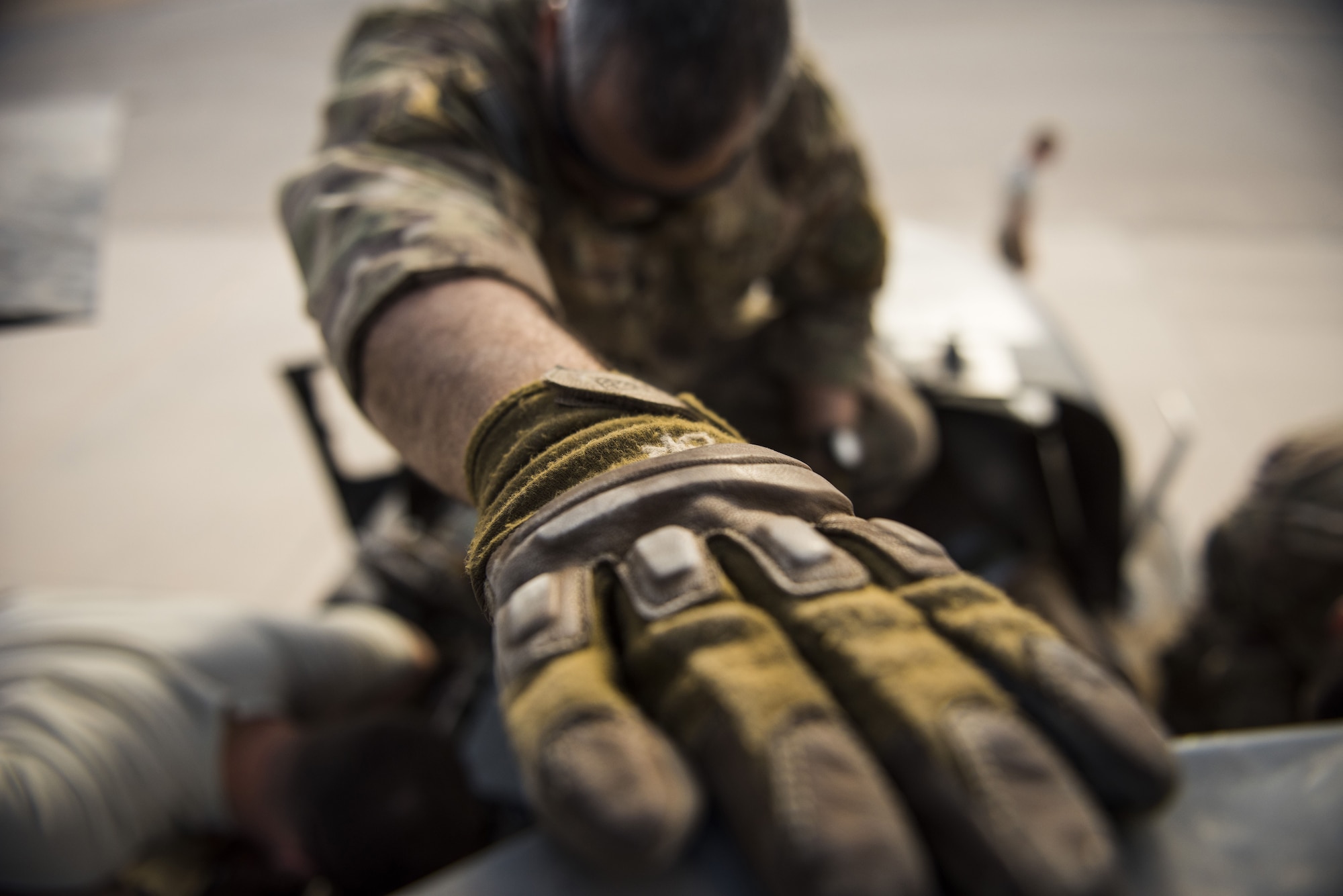 Maintainers assigned to the 801st Expeditionary Maintenance Squadron work
together on HH-60G Pave Hawk helicopter engine components November 22, 2017,
in an undisclosed location. Maintenance professionals of the 801st EMXS must
keep as many aircraft as possible prepared to fly in less that 30 minutes.
(U.S. Air Force photo by Staff Sgt. Joshua Kleinholz)