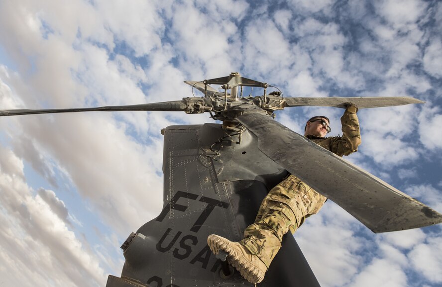 A special missions aviator assigned to 46th Expeditionary Rescue Squadron,
inspects the blades on an HH-60G Pave Hawk helicopter tail rotor prior to a
sortie November 22, 2017, in an undisclosed location. Rotor blades are
subjected to massive amounts of force in-flight and require frequent
inspections and repairs in order to ensure safe flight. (U.S. Air Force
photo by Staff Sgt. Joshua Kleinholz)