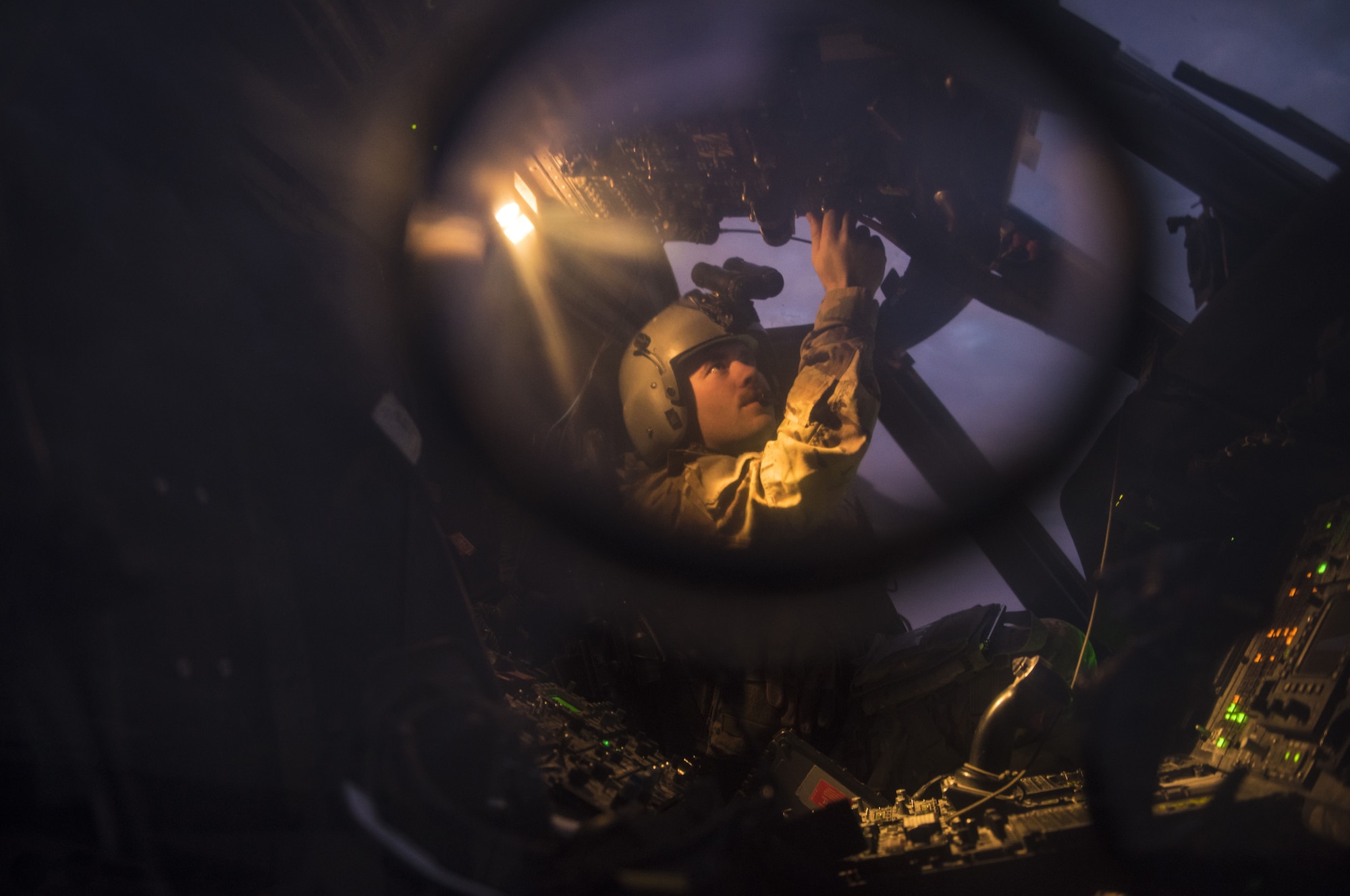 A pilot assigned to the 46th Expeditionary Rescue Squadron checks avionics
systems on an HH-60G Pave Hawk helicopter prior to a sortie November 22,
2017, in an undisclosed location. Combat search and rescue aircrews
frequently train in low-light conditions to keep skills sharp should they
ever be called to recover isolated personnel under the cover of night. (U.S.
Air Force photo by Staff Sgt. Joshua Kleinholz)