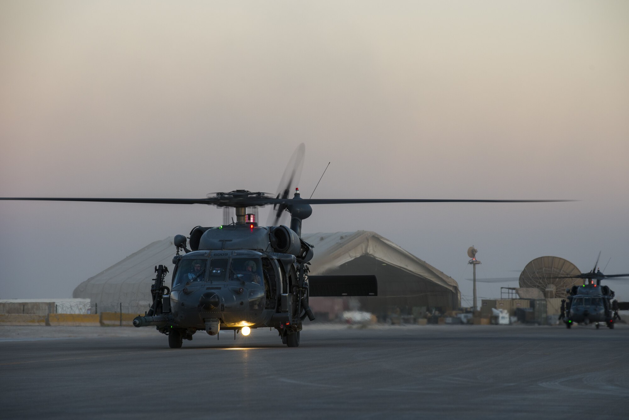 HH-60G Pave Hawk Helicopters assigned to the 46th Expeditionary Rescue
Squadron, return to base following the completion of a sortie, October 24,
2017 in an undisclosed location. Rescue teams-comprised of pilots, special
missions aviators, and pararescuemen - work together to maintain a constant
state of readiness. (U.S. Air Force photo by Staff Sgt. Joshua Kleinholz)