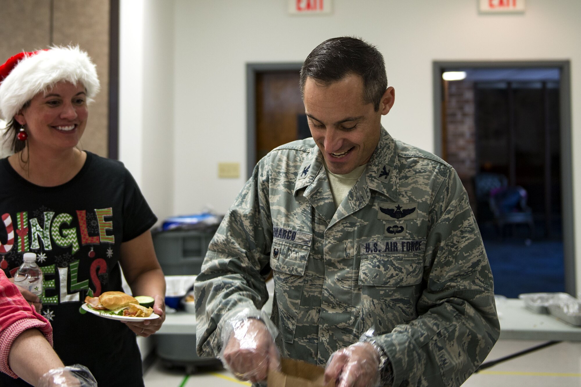 Col. Justin Demarco, 23d Wing vice commander, fills bags with cookies during the Annual Moody Airmen Cookie Drive, Dec. 4, 2017, at Moody Air Force Base, Ga. Local organizations, Airmen and spouses donated more than 8,000 cookies to approximately 700 dorm residents to show appreciation for the Airmen during the holidays. (U.S. Air Force photo by Airman 1st Class Erick Requadt)