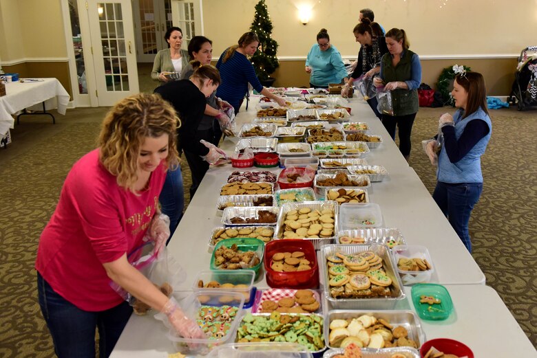 Members of Team Seymour pack donated cookies during the annual Officer and Civilian Spouses Club Airmen Cookie Drive Dec. 4, 2017, at Seymour Johnson Air Force Base, North Carolina.
