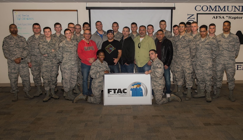 U.S. Air Force Airmen and leadership from the First Term Airman Course pose for a photo with Ultimate Fighting Championship fighters, UFC’s creator and Mixed Martial Arts junkie radio hosts during the MMA Legends Tour at Joint Base Langley-Eustis, Va., Dec. 1, 2017.