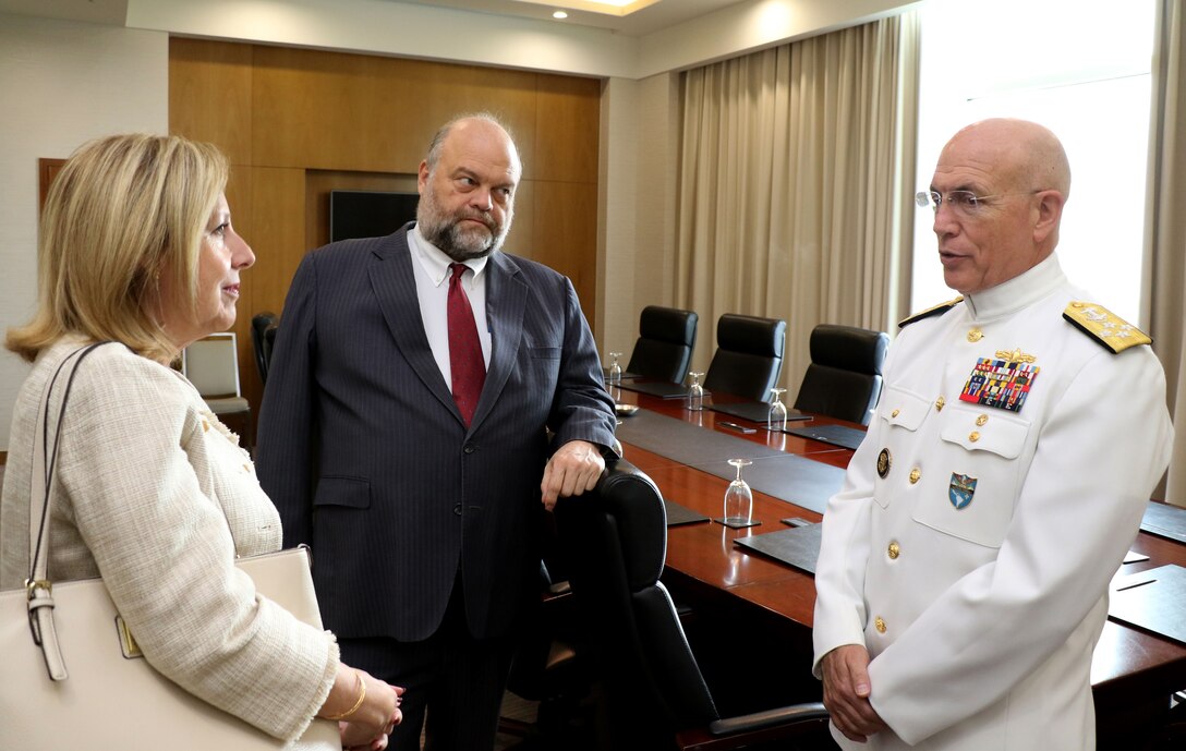 U.S. Navy Adm. Kurt Tidd speaks with U.S. Ambassador to Guyana Perry Holloway.