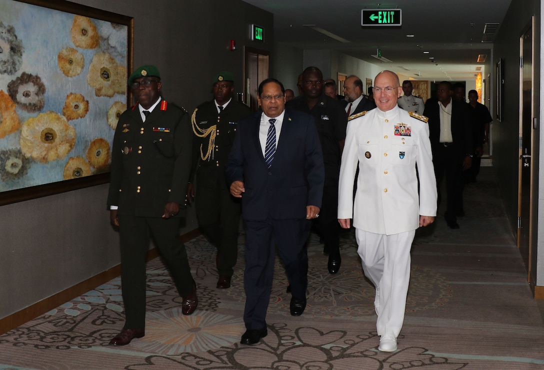 Military leaders walk together in Guyana.