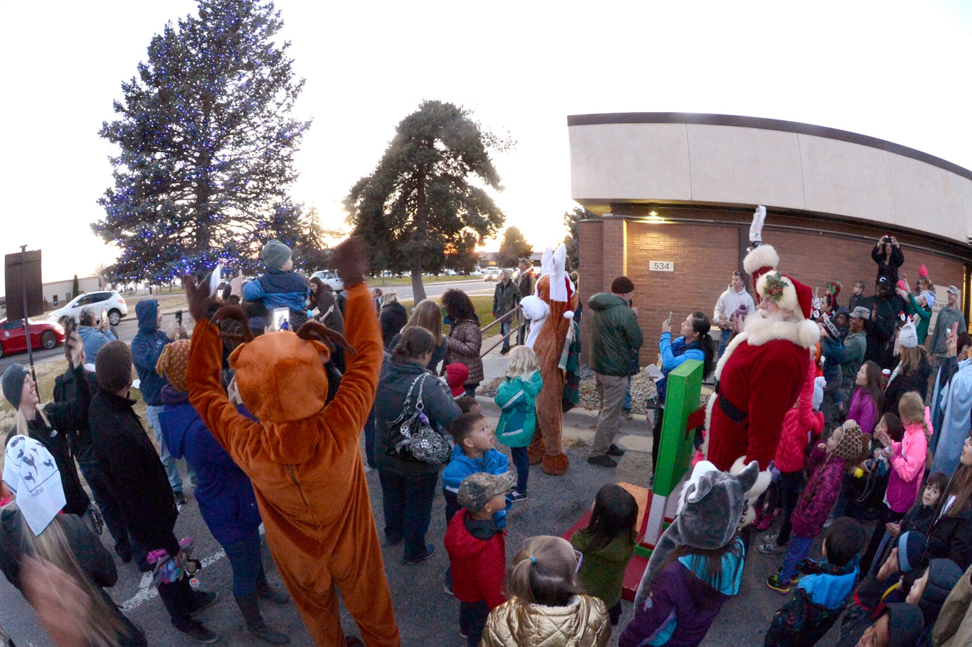 CHILDREN JOIN SANTA TO BRING IN THE HOLIDAYS