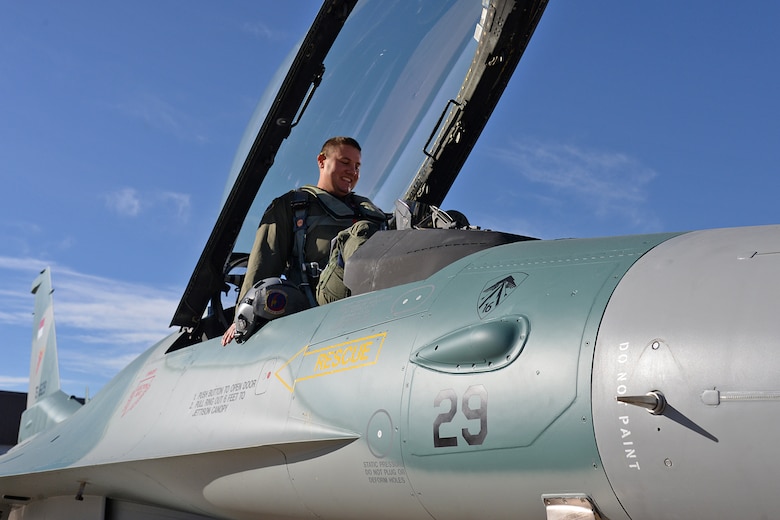 Lt. Col. Beau “Strap” Wilkins, 514th Flight Test Squadron, climbs into the cockpit of an Indonesian F-16C Fighting Falcon Nov. 21, 2017, at Hill Air Force Base, Utah. Wilkins conducted a functional check flight on the jet to ensure the overhaul and upgrades completed on the aircraft worked properly. (U.S. Air Force photo by Alex R. Lloyd)