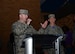 Chief Master Sgt. Adam Vizi, the 28th Bomb Wing command chief, and Col. John Edwards, the 28th BW commander, welcome Airmen and family members to the Base Holiday Tree Lighting Ceremony at Ellsworth Air Force Base, S.D., Dec. 1, 2017. The event included speeches from distinguished visitors, a surprise visit from Santa Claus, holiday music and seasonal treats for all who attended the ceremony. (U.S. Air Force photo by Airman 1st Class Donald C. Knechtel)