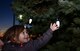 Alaina Lara, daughter of Senior Airman Ashley Sammelman, a metals technician assigned to the 28th Maintenance Squadron, reaches for one of the Christmas tree lights during the Base Holiday Tree Lighting Ceremony at Ellsworth Air Force Base, S.D., Dec. 1, 2017. This annual event provides Airmen and their families a chance to celebrate the holiday season with their community. (U.S. Air Force photo by Airman 1st Class Donald C. Knechtel)