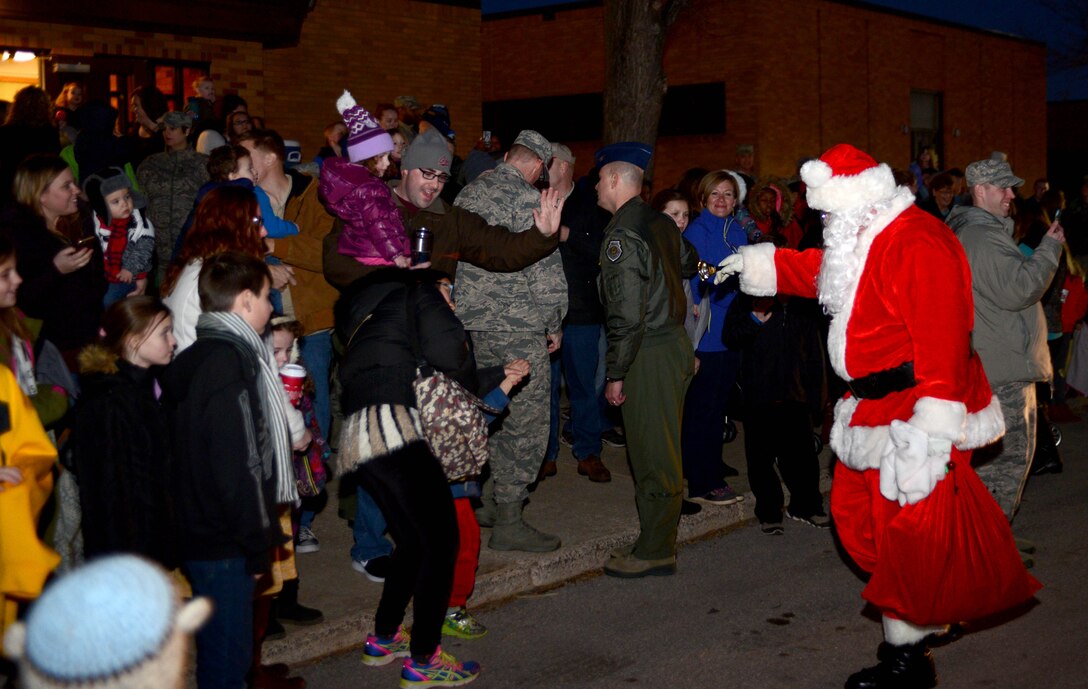 Santa Claus gave a surprise visit for children of Ellsworth during the Base Holiday Tree Lighting Ceremony at Ellsworth Air Force Base, S.D., Dec. 1, 2017. After his arrival, families where led inside where children were able to sit on Santa’s lap, receive some holiday candy, and tell him their Christmas wishes. (U.S. Air Force photo by Airman 1st Class Donald C. Knechtel)