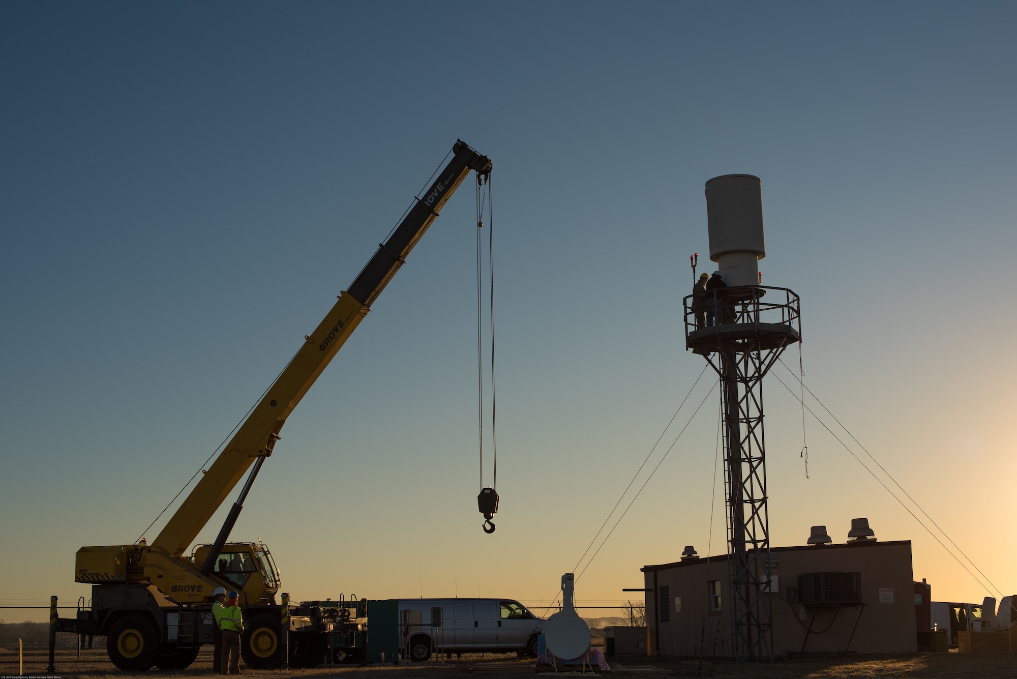 Airmen and contractors prepare to replace a legacy Tactical Air Navigation System (TACAN) with a modern version at Offutt Air Force Base, Nebraska, Nov. 29, 2017.