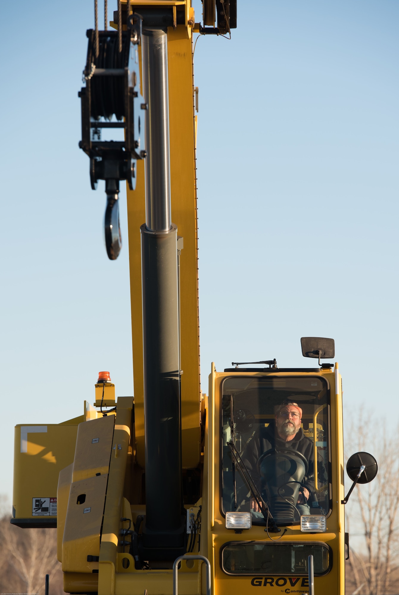 Tim Luscom, 55th Civil Engineer Squadron engineering equipment operator, controls a crane to replace Offutt Air Force Base’s (AFB) legacy Tactical Air Navigation System (TACAN) at Offutt AFB, Nebraska, Nov. 29, 2017.