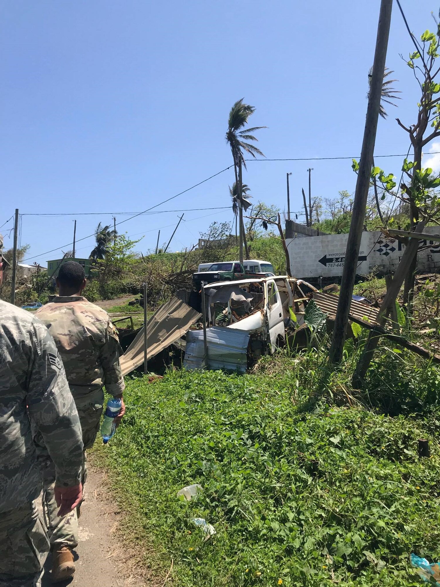 U.S. service members survey damage, Oct. 9, 2017 on the Caribbean island of Dominica.