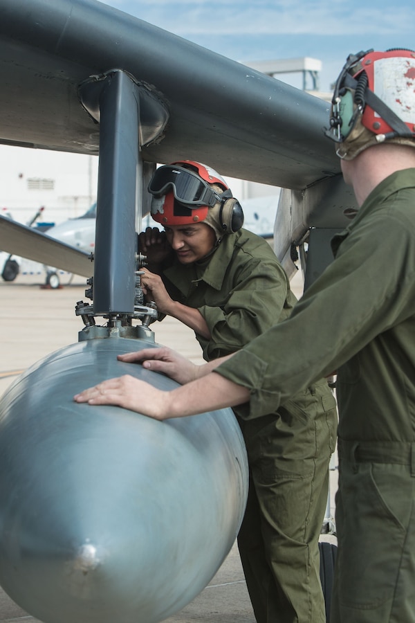 Lance Cpl. David Gaytan, an aircraft ordinance technician with Marine Attack Squadron (VMA) 214 removes ordnance from an AV-8B Harrier II during Exercise Winter Fury 18 at Marine Corps Air Station Miramar, Calif., Nov. 29. Marines prepared several Harriers to support Winter Fury 18, which spans several locations including Marine Corps Air-Ground Combat Center Twentynine Palms, Marine Corps Base Camp Pendleton, MCAS Miramar and MCAS Yuma, Ariz. (U.S. Marine Corps photo by Lance Cpl. Nadia J. Stark/Released)