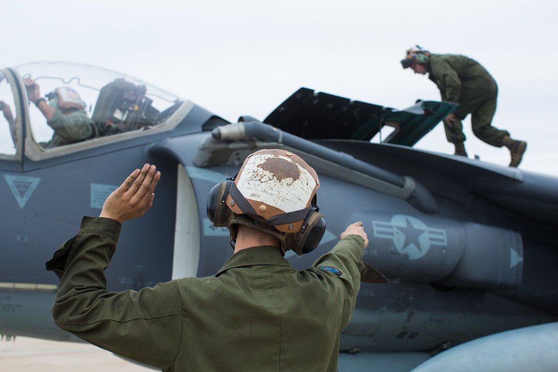 Marines with Marine Attack Squadron (VMA) 214 prepare an AV-8B Harrier to support training missions during Exercise Winter Fury 18 at Marine Corps Air Station Miramar, Calif., Nov. 30. Winter Fury provides an opportunity for 3rd Marine Aircraft Wing to exercise the skills needed as the aviation combat element of a Marine Air-Ground Task Force during a combat deployment. (U.S. Marine Corps photo by Lance Cpl. Nadia J. Stark/Released)