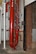 Red-painted fire-suppression pipes are shown near an opened vertical roll-up door in Bldg. 3001 on Nov. 17, 2017, Tinker Air Force Base, Oklahoma. Areas like this have a higher potential for proximity freezing if not monitored closely and doors aren't closed to keep the heat in during below-freezing periods.