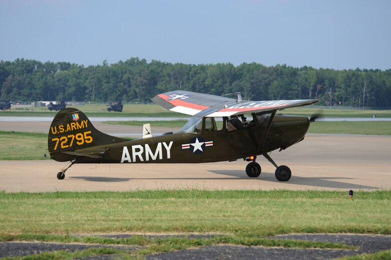 US Army Cessna O-1, serial # 57-2795 (N32FL) taxis on the grass at Ft. Campbell, KY during the Army Aviation Heritage Foundation's 'Rescue at Dawn' Vietnam-era downed pilot scenario.