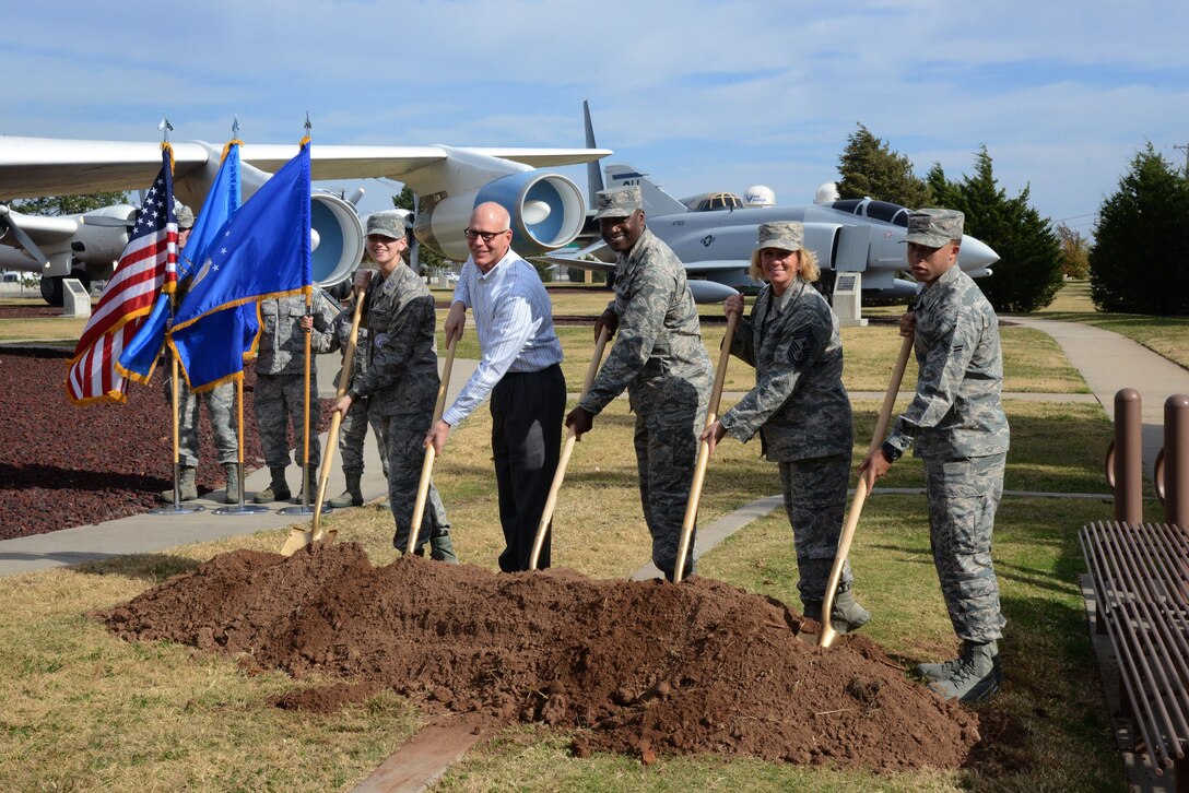 Participants in the groundbreaking for the 75th Anniversary Time Capsule were, from left, JROTC Cadet Col. Avery Stout, with Carl Albert High School and representing a future Airman; retired Air Force Lt. Col. Steve Auchter, with Tinker Heritage Foundation; 72nd Air Base Wing Commander Col. Kenyon Bell; 72nd ABW Command Chief Master Sgt. Melissa Erb; and Airman 1st Class Alexander Williams, with the 72nd Medical Group and representing the youngest Airman.