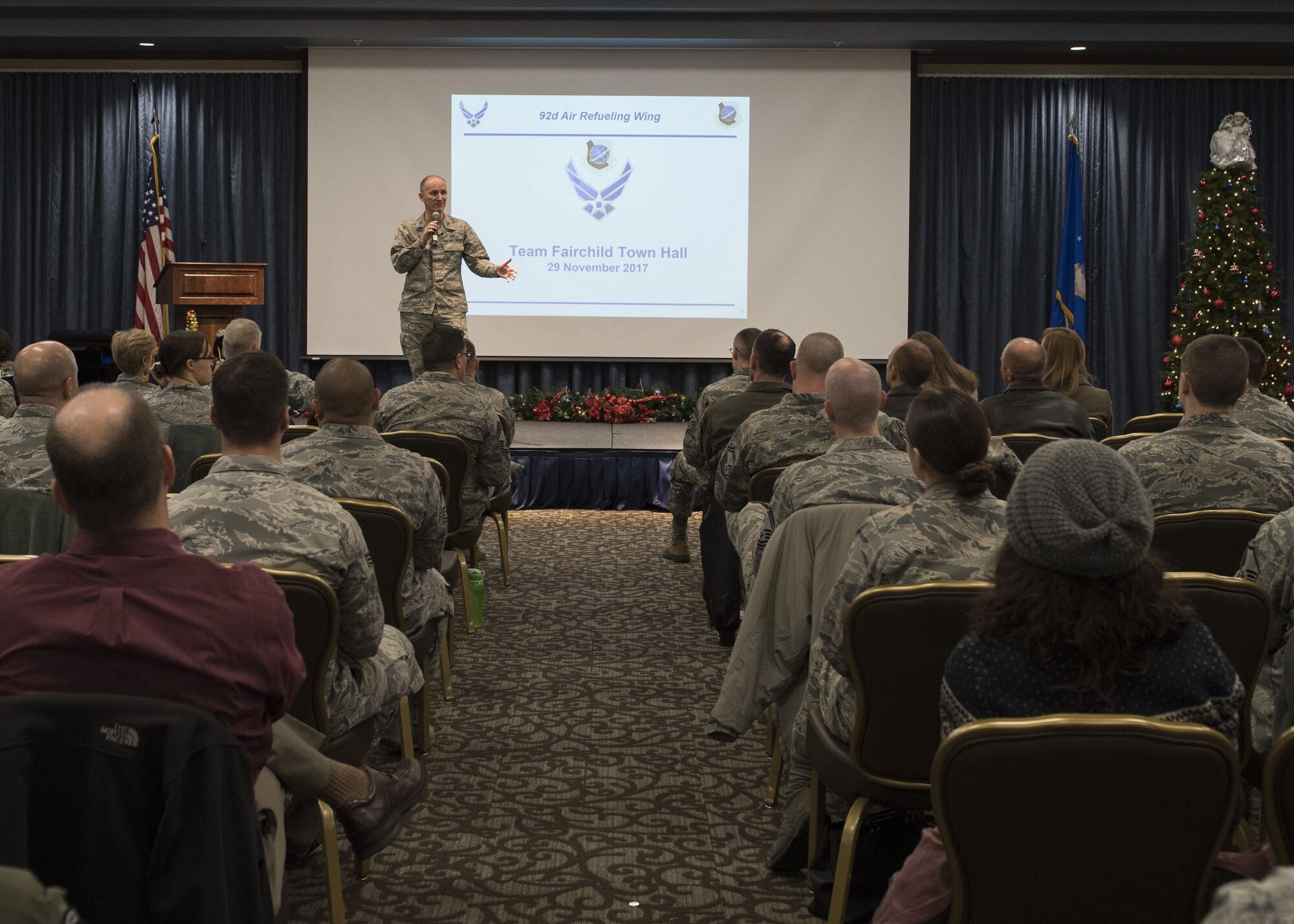 Col. Ryan Samuelson, 92nd Air Refueling Wing commander, kicks off the base town hall meeting at the Red Morgan Center, Fairchild Air Force Base, Washington, Nov. 29, 2017. The town hall meeting gives base leadership an opportunity to address quality-of-life topics that affect base members and their families. (U.S. Air Force photo/Senior Airman Ryan Lackey)