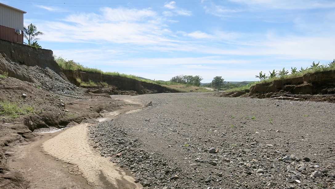 Hurricane Maria-induced flooding breached a levee in Yauco, Puerto Rico, flooding homes, businesses and rendering roads impassable.