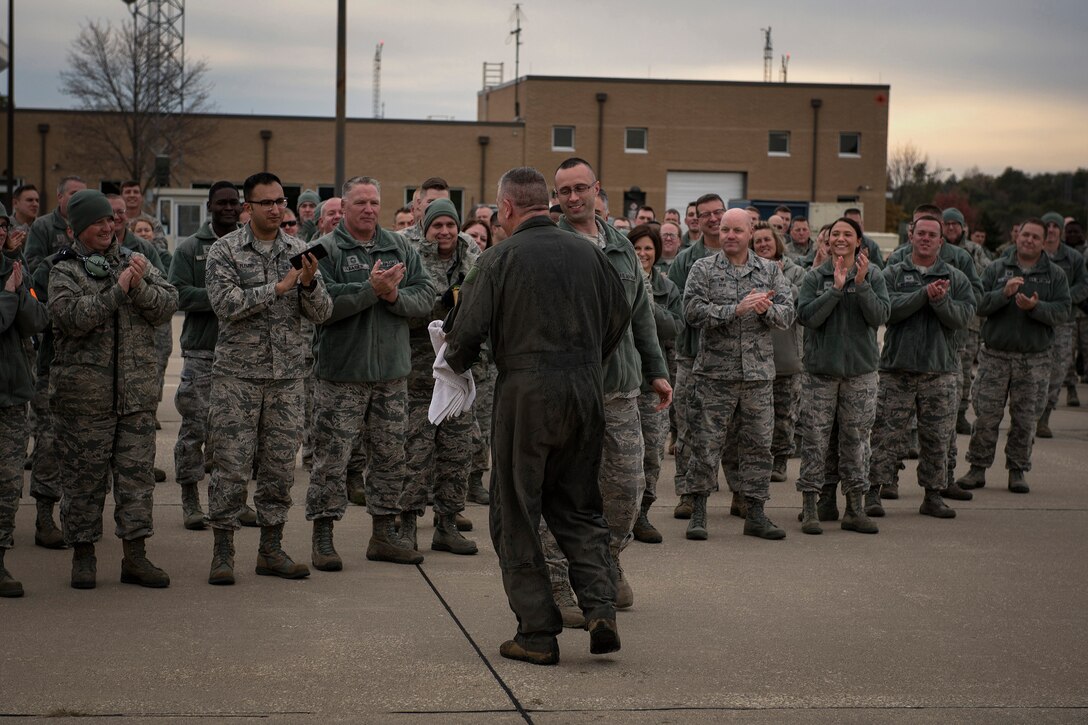 Airmen applaud Col. William Robertson, the commander of the 182nd Airlift Wing, Illinois Air National Guard, after his final C-130 Hercules flight in Peoria, Ill., Oct. 31, 2017. Robertson commanded the wing for 13 years before his promotion to brigadier general and appointment to the role of chief of staff of the Illinois Air National Guard in November 2017. (U.S. Air National Guard photo by Tech. Sgt. Lealan Buehrer)