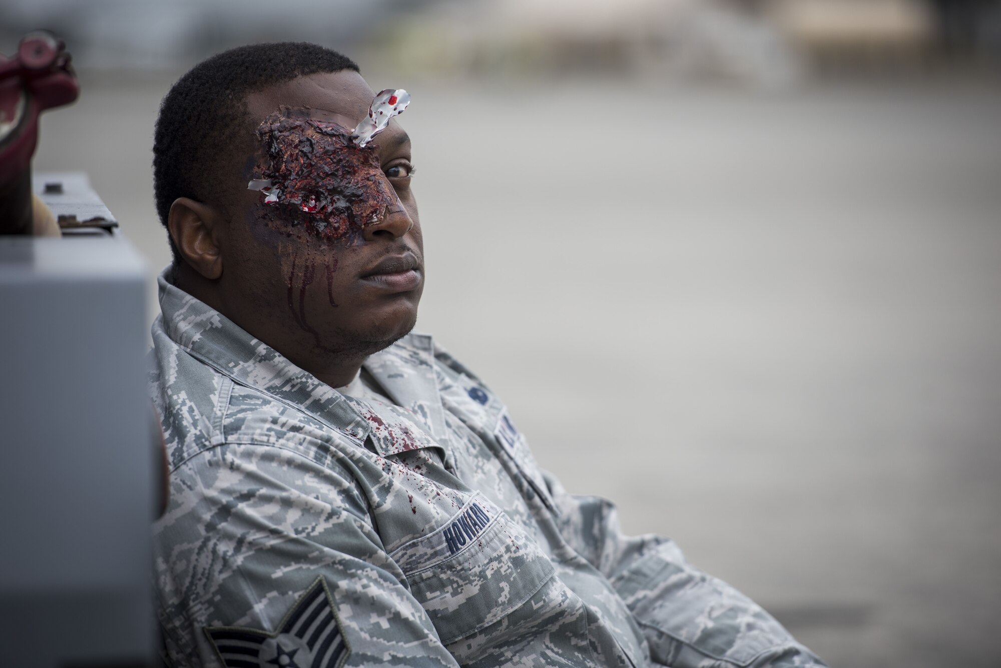 A simulated injured service member waits for emergency response teams during exercise Beverly Morning 17-08 in conjunction with exercise Vigilant Ace 18, Dec. 4, 2017, at Yokota Air Base, Japan.