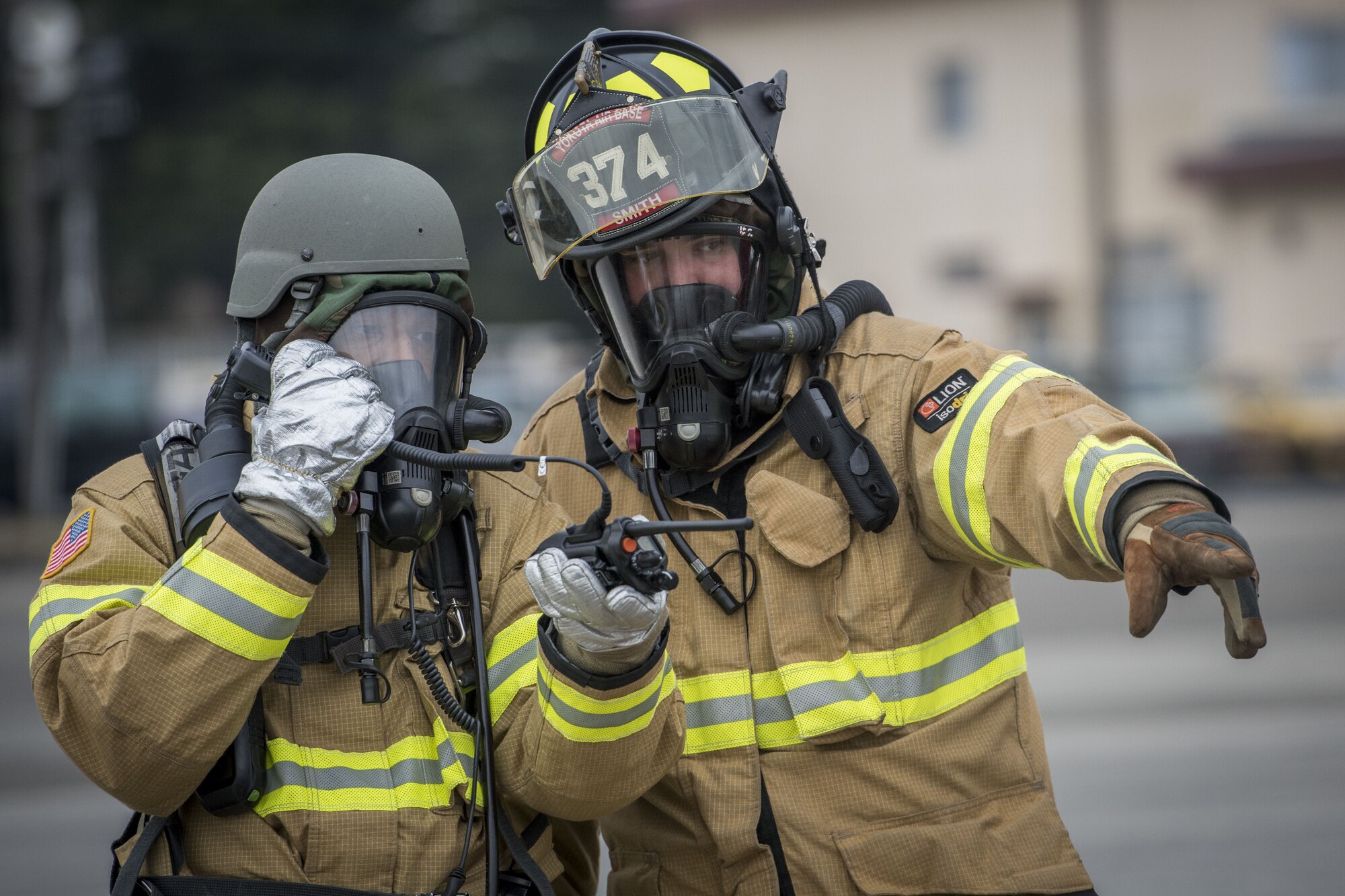 Firefighters with the 374th Civil Engineer Squadron communicate emergency procedures during exercise Beverly Morning 17-08 in conjunction with exercise Vigilant Ace 18, Dec. 4, 2017, at Yokota Air Base, Japan.